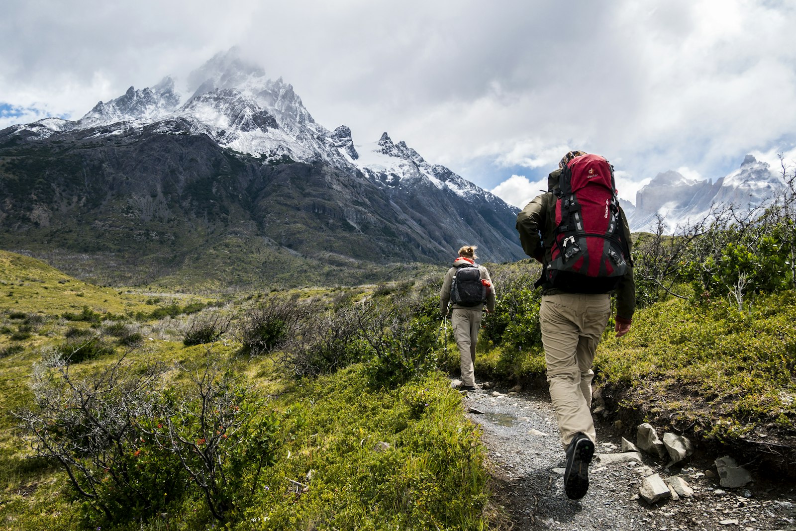 Two people hiking a mountain trail