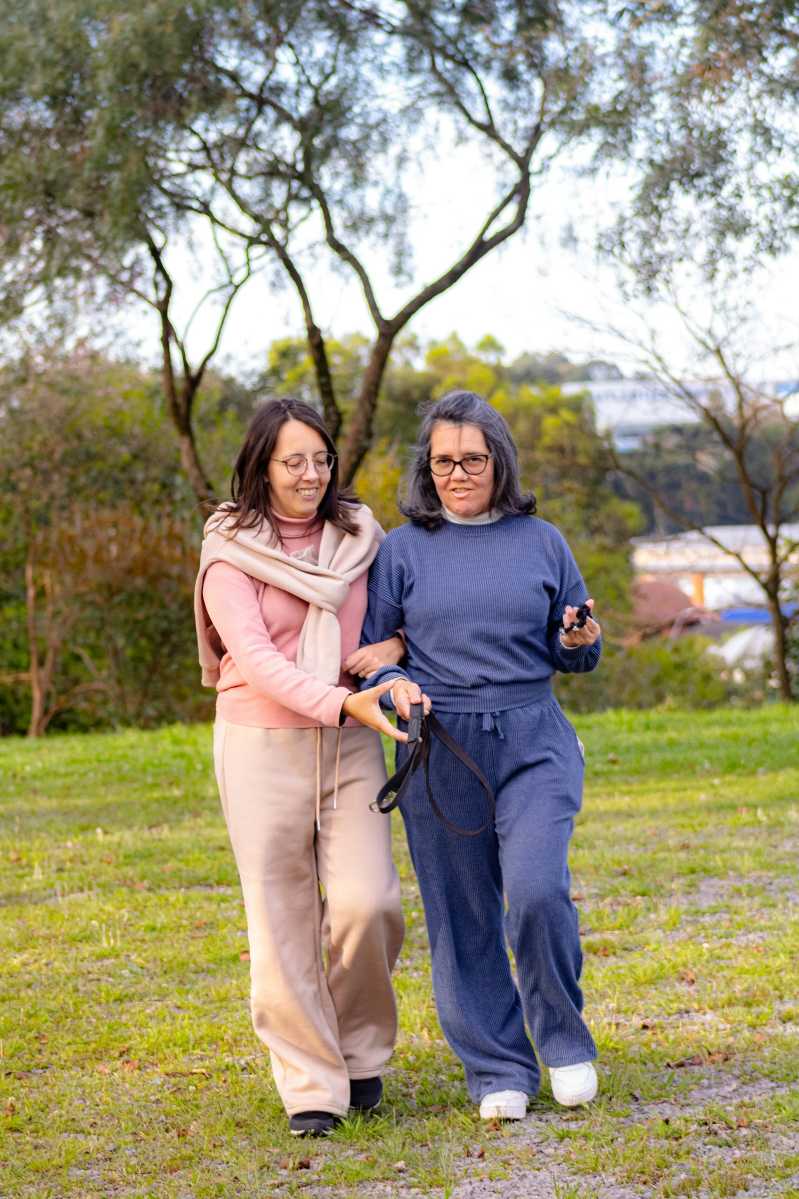 Two women walking together outdoors